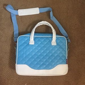 Blue computer bag with strap and handles