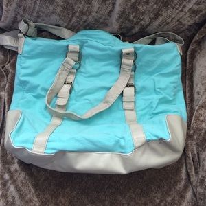 Aqua and cream across the body bag