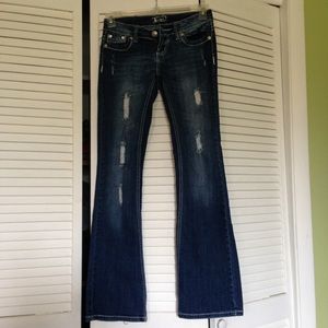 Bedazzled boot-cut torn jeans