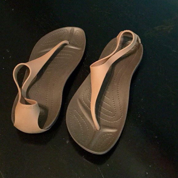 NWOT.  Crocs Light Tan Thongs, Size 8