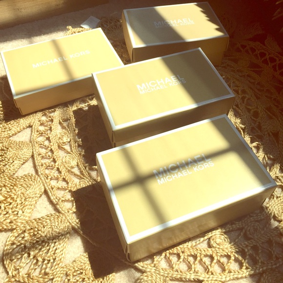 4 small Michael Kors boxes
