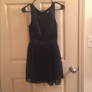 Black cocktail dress with open back detail