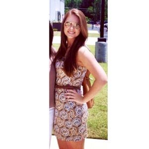 Tan and blue patterned dress with beaded neckline