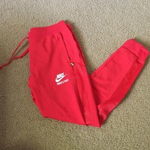 Red mesh Nike sweatpants