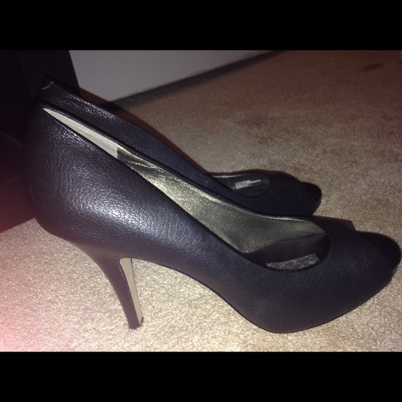 Black leather peep toe pumps