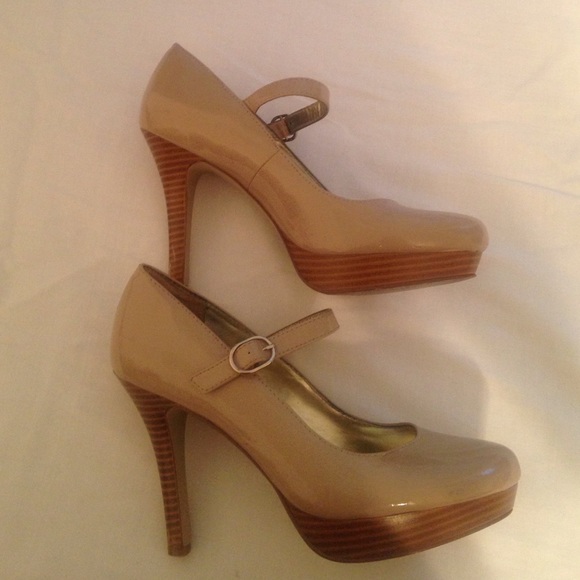 Nude and wood Mary Jane heels.