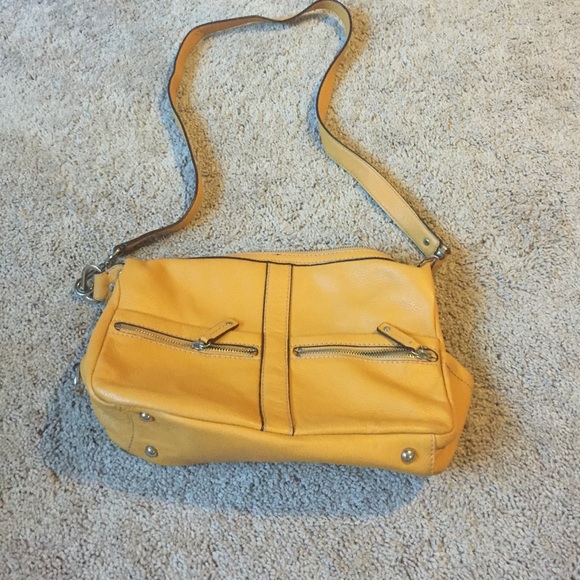 Genuine  leather cross body bag .