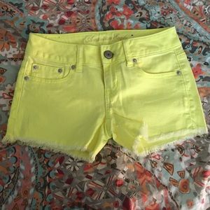 American Eagle bright yellow cut off shorts