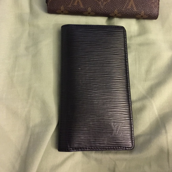Louis Vuitton check book or wallet.