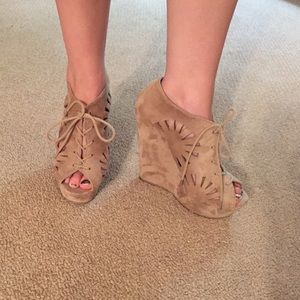 Tan faux suede lazer cut out wedges.