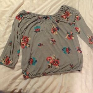 gray shirt with flowers :)
