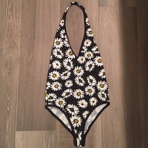 Body suit. Deep plunge. Black less.