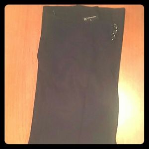 Black trousers, three button faster adds interest