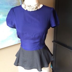 Color block peplum top with zipper detailing