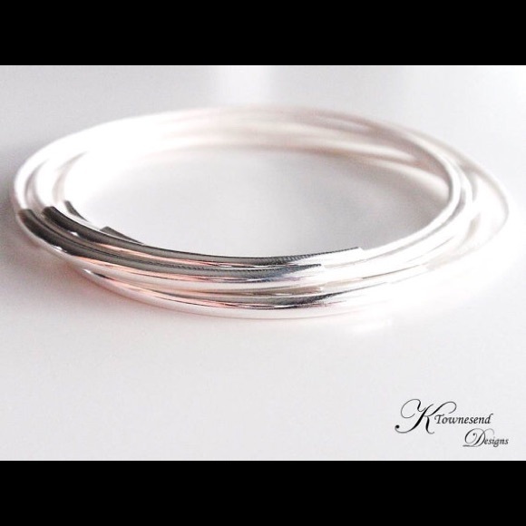 White leather and silver hardware bangle bracelets