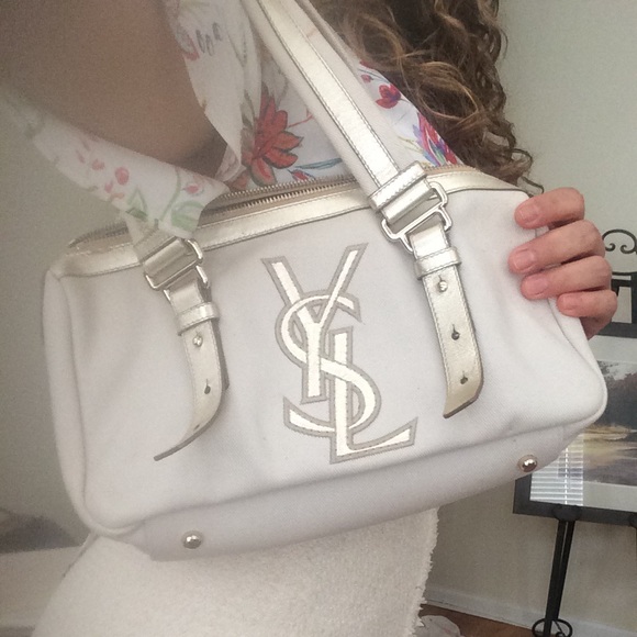 Yves saint Laurent handbag with logo in front.