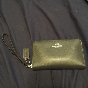 Black Coach wristlets.