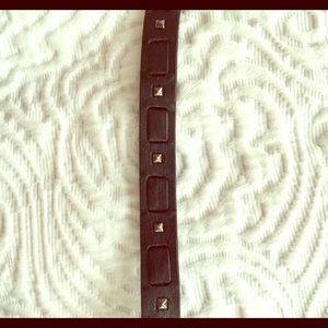 Thin black belt with studded detailing