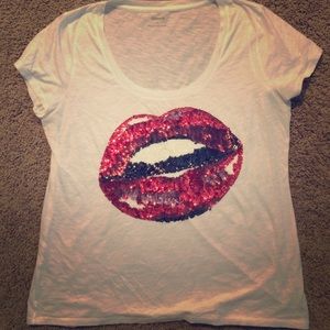 White shirt with sequence lips.