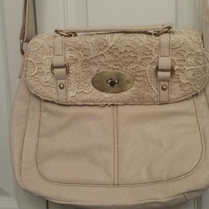 Purse with adjustable, long strap. Cream colored.
