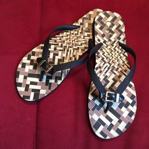 Cole Haan patterned flip flops w/ buckle detail