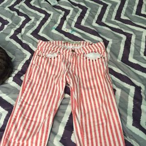 Orange and white striped skinny jeans.