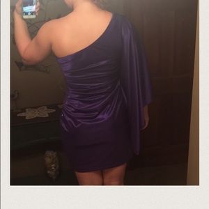Purple one sleeved cocktail dress.
