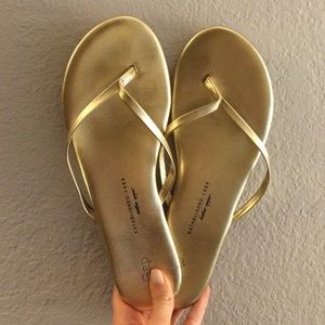 Gold flip flops