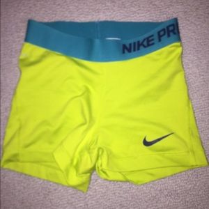 Neon yellow and blue nike pros