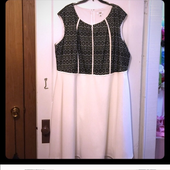 Bundle of white dress and black skirt.