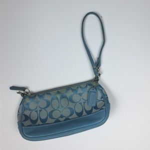 Small blue coach clutch
