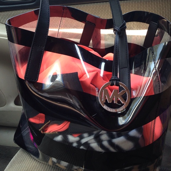 Clear mk bag bag as is few scratches nothing else