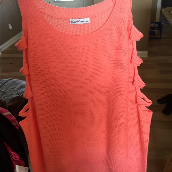 Knit sweater with holes along the arms