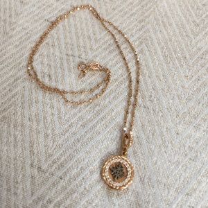 14KT gold chain with intricate "Harmony" pendent.