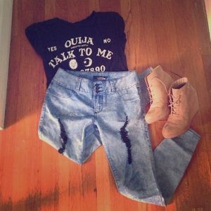 Acid wash ripped blue jeans