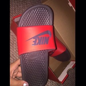 black and red Nike slides