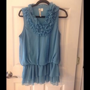 Blouse with high collar ruffle detail.