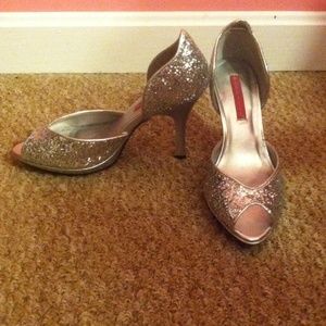 Silver sparkley 3 1/2 inch Bordello heels.