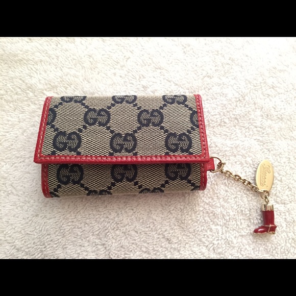 Gucci GG supreme canvas key case with charm.