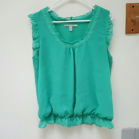 Green dressy tank top with ruffle accents
