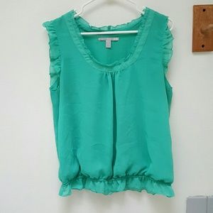 Green dressy tank top with ruffle accents