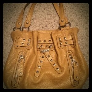 Kathy Van Zeeland yellow purse