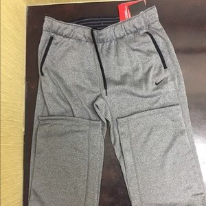 Gray Nike therms-fit sweatpants.