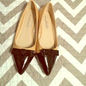 Super cute nude and black bowed flats