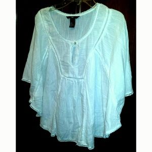 White cape blouse.