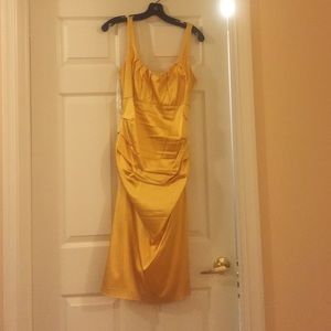 Golden yellow knee length satin style dress