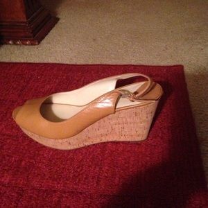 A wedge heel sandal.