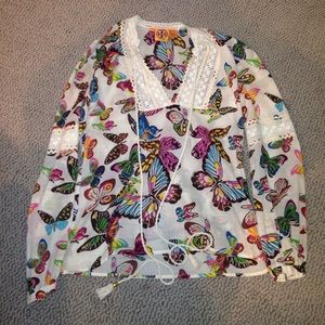 White blouse with colorful butterflies.