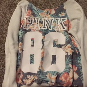 PINK, floral sweater with white fabric.