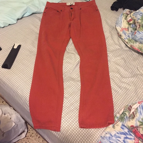 Trendy dark orange/red jeans